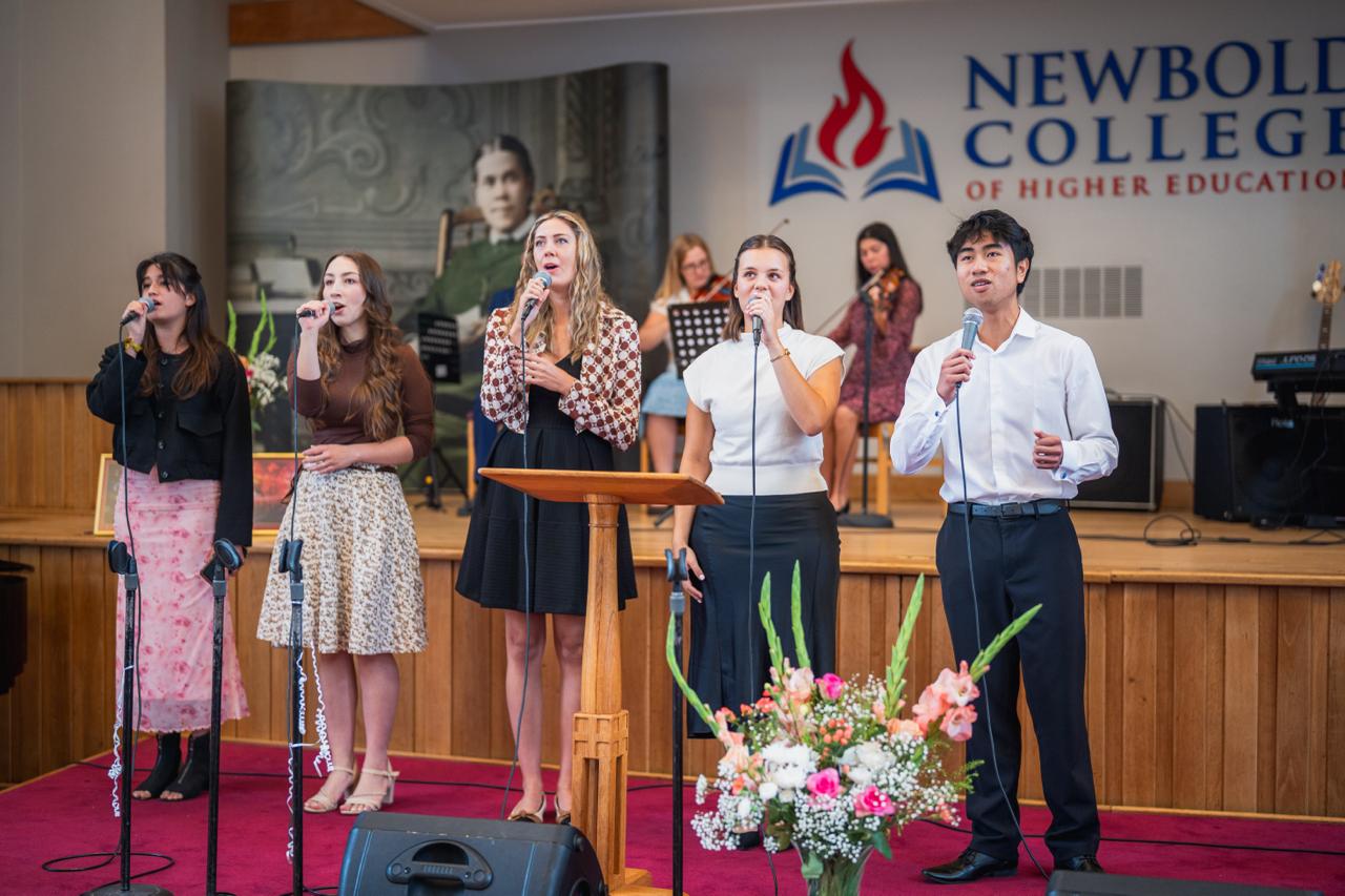 Young adults leading worship in the Newbold chapel