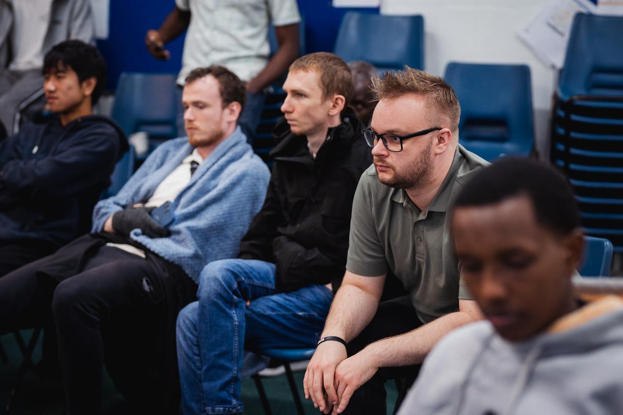 Students listening during a retreat gathering