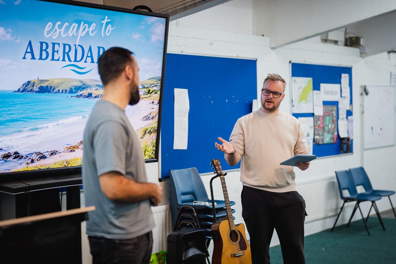 A speaker sharing with students at Aberdaron