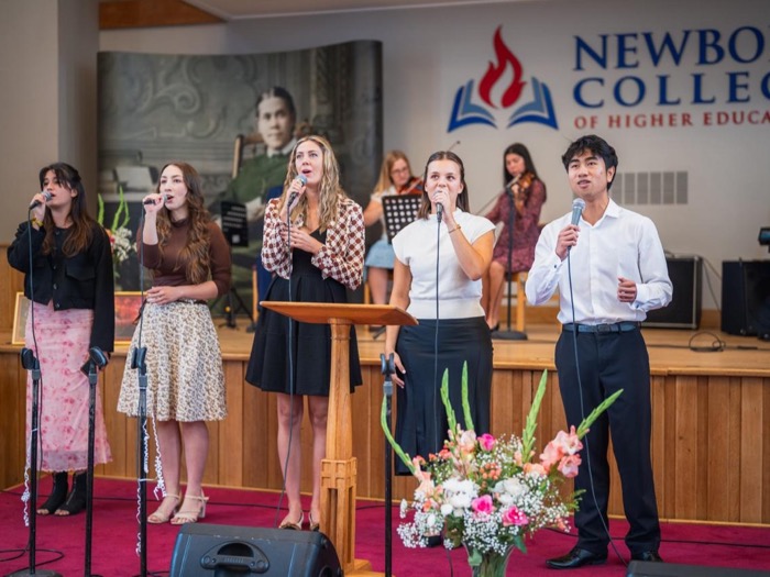 Young adults leading worship at the Ellen G. White Youth Symposium